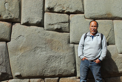 Lang with famous 12 corners stone in Cusco.