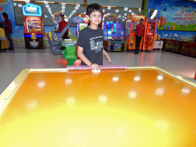 Play air hockey