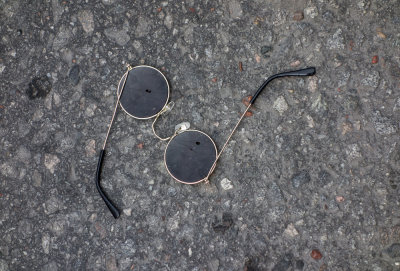 Glasses on tarmac