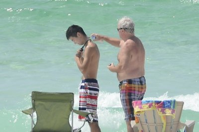 Good boys -- to put sun block on.