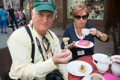 Having coffee and dessert.