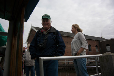 Boarding a boat to tour the windmills in Kinderdijk, The Netherlands.