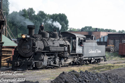 A hostler adds sand to the K36 488 after its turned the train and is headed to the house