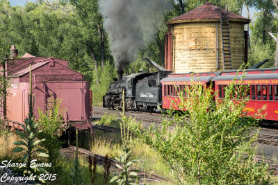 K36 489 is passing the Chama tank as it leads the Sunset train out of Chama