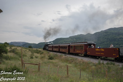 The Sunset train moves away from route 17 as a rider takes a picture of the picture takers