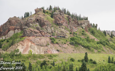 The Sunset train is rounding Windy Point as it is almost to Cumbres Pass