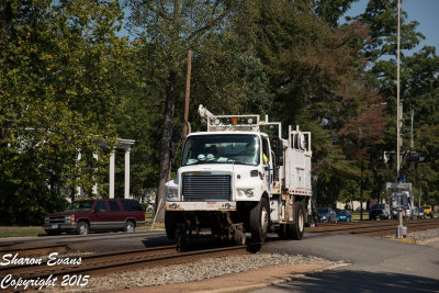 A second large hirail truck come south by Ashland
