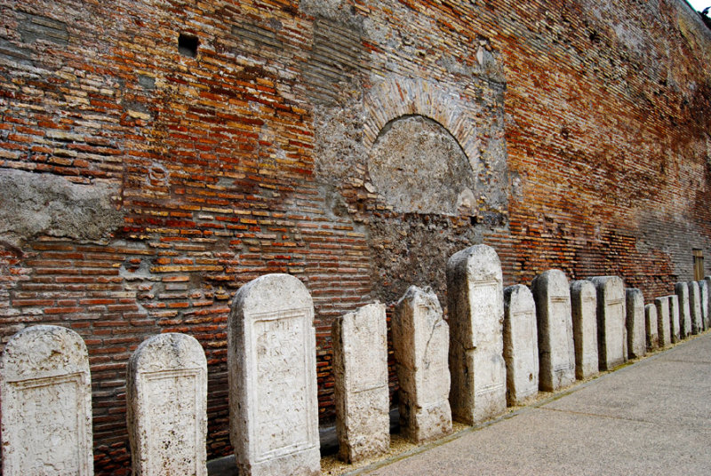 Memorial Stones line a Brick Wall of the Baths6648