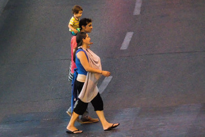 Young family lit by traffic lights