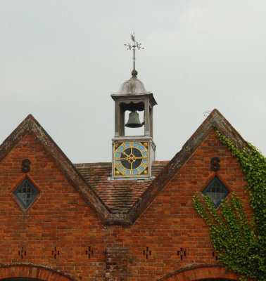 Clock tower and bell on the old stables, now a garage.