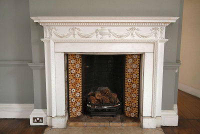 CC035. A period fireplace of 18th  Century - if you ignore the 13amp power sockets 