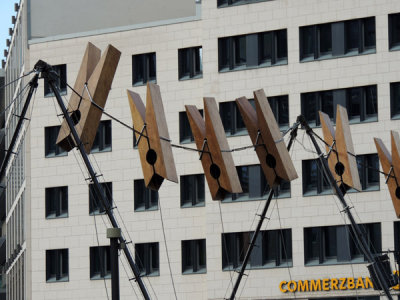 Giant clothespins stung on a wire next to Commerzbank, Frankfurt
