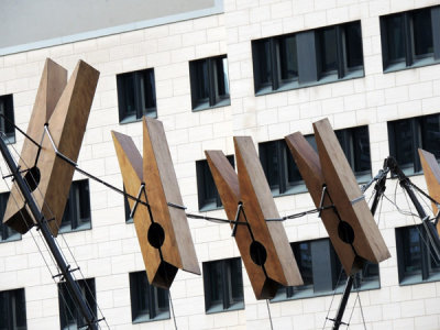 Giant clothespins stung on a wire next to Commerzbank, Frankfurt