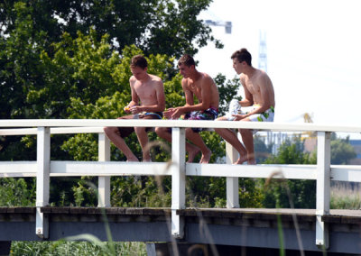 Local Dutch boys enjoying the war July day at Kinderdijk