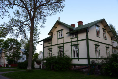 White house with green trim and a green tin roof, Mariehamn