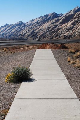 Sidewalk to nowhere at I-70 viewing area (at the end of the sidewalk, a vault toilet was being replaced)