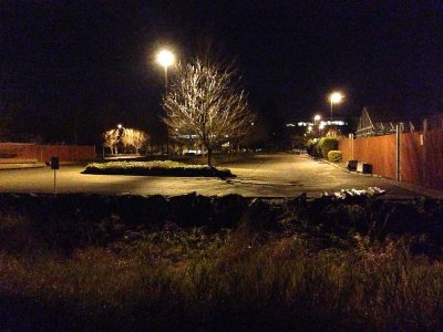 Commercial parking lot, seen from the Interurban Trail