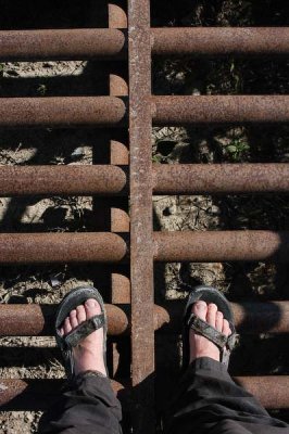 Standing on cattle guard with salty sandals