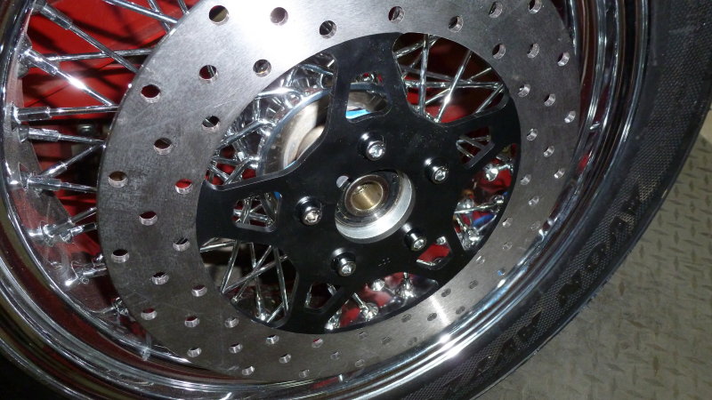 I painted the spokes on the rotor to offset the chrome spoke wheel. Drilled the mounting holes using it as a template.