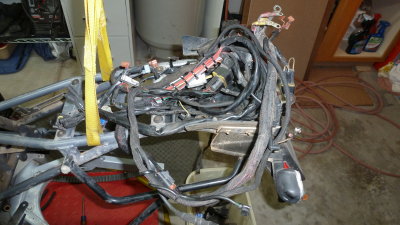 Wire harness is coiled on the rear frame.