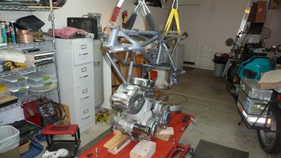 Both raising the hoists and lowering the lift - the engine is wiggled out and frame is free. 