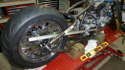 2 spacers moved the sprocket out 1/4. Now to recheck the wheel alignment to see if it clears.