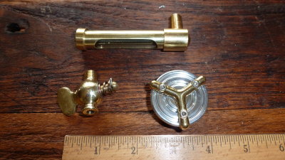 Bought the brass spigot & sight gauge from an antique car parts house. The cap is from Mooneys race equipment.