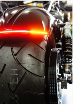 Two integrated LED tail light strips from Radientz (their photo). Will seat in fender channels - VERY bright.