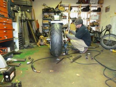 With his dog supervising, Phil starts planning the routing of the exhaust. 