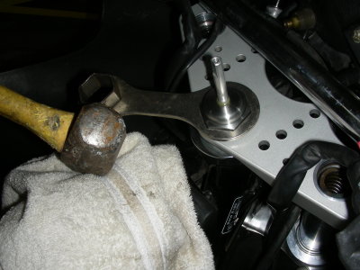 Couldn't use a socket with the damper rod so tool kit spanner & a couple good whacks.