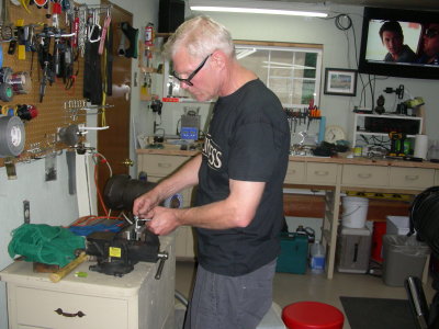 Jerome pulling the studs out of the riser caps for longer bolts.