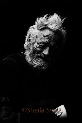 Aged man with eyes closed in monochrome