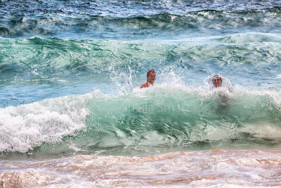 Two guys having fun in surf