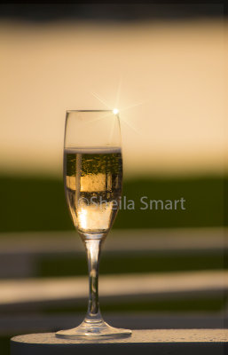 Champagne glass at sunset
