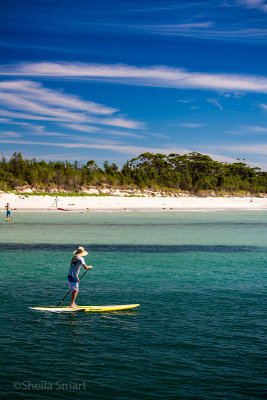 Lady on surf paddle at Huskisson 