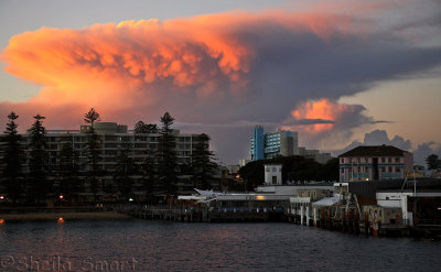 Manly with dramatic red cloud