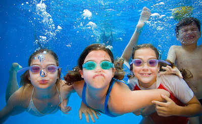 Children swimming underwater - kids having fun