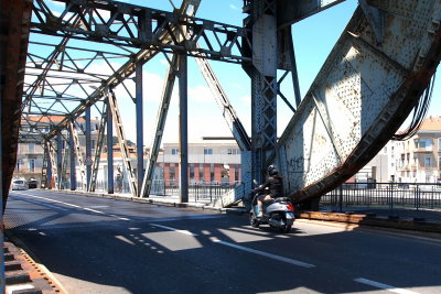 Motor Scooter On Lifting Bridge