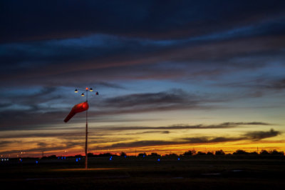 Sunrise and the wind sock before a Flight.
