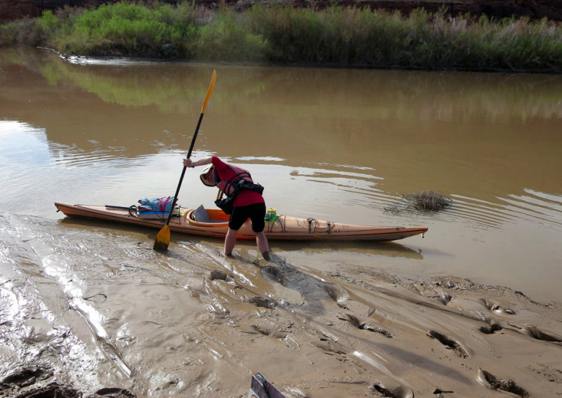 Martina sinking into the river mud