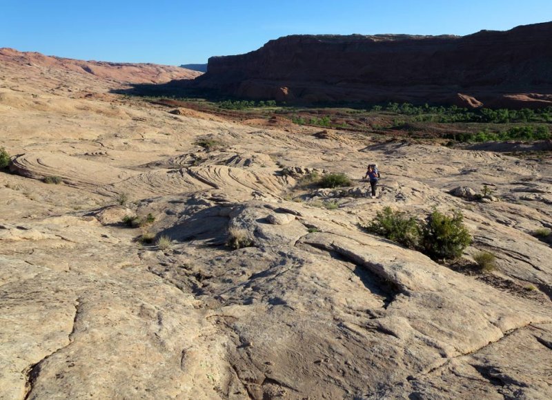 Climbing the rock slabs from Halls Creek into the Escalante drainage 
