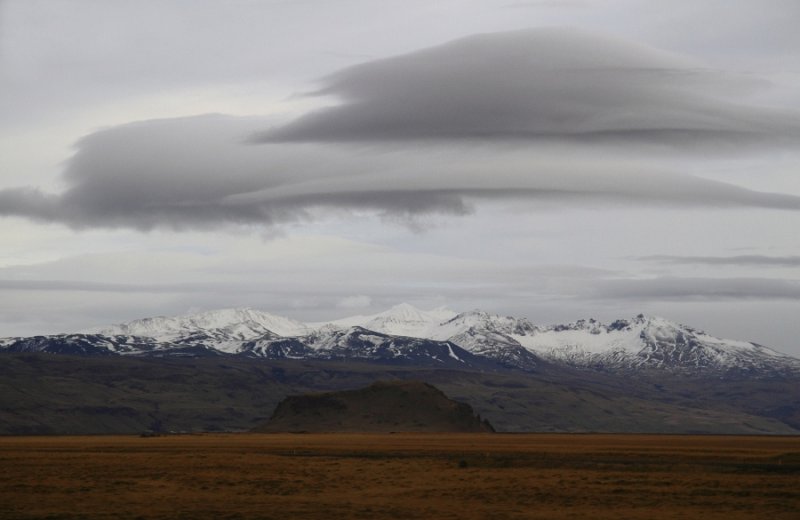 Lenticular clouds over volcanoes