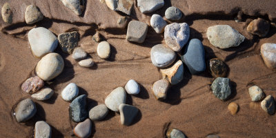 Stones in Wet Sand 