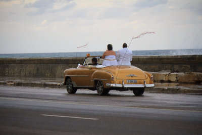 newly weds cruising on the Malecon, Havana