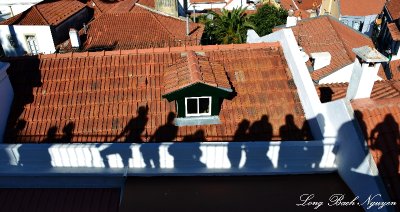 tourist shadows Lisbon Portugal  
