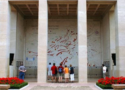 Visitors at Battle Map, Normandy American Cemetery, Colleville-sur-Mer, France  