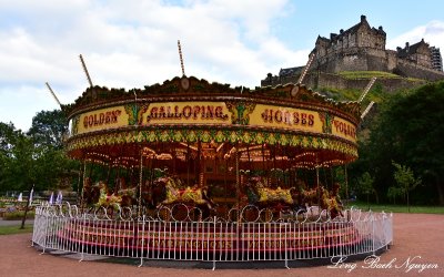 Carousel in shadow Edinburgh Castle, Princes Street Gardens, Edinburgh, Scotland, UK  