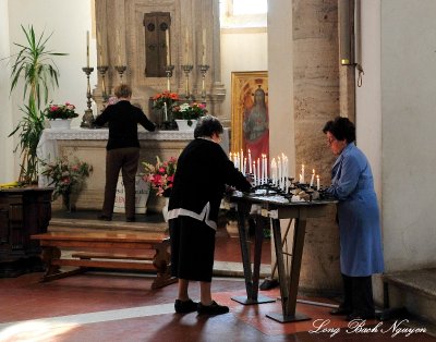 Three ladies tend Altar, Pienza Cathedral, Italy  