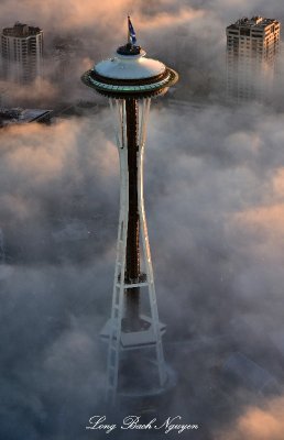 Space Needle high above fog with 12 Flag 