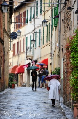 Carefully Walking in narrow street of Montalcino Tuscany Italy 130 